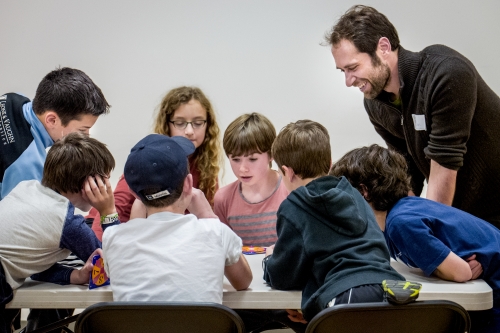Finkel leads a group of children learning about math